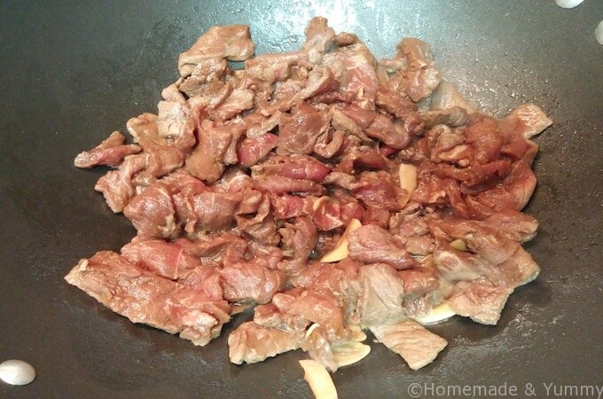 Stir fry the thinly sliced pieces of beef. 