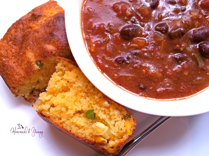 Close up of Chunky Chili in a bowl with cornbread on the side.