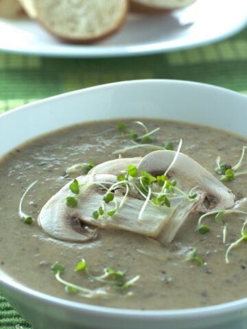 Fresh and dried mushrooms are used to make this Creamy Multiple Mushroom Soup. Thick, rich and earthy, perfect as an appetizer or main dish paired with some great bread. | homemadeandyummy.com