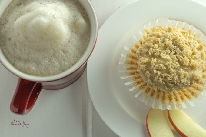 Freshly baked apple muffin and a latte.