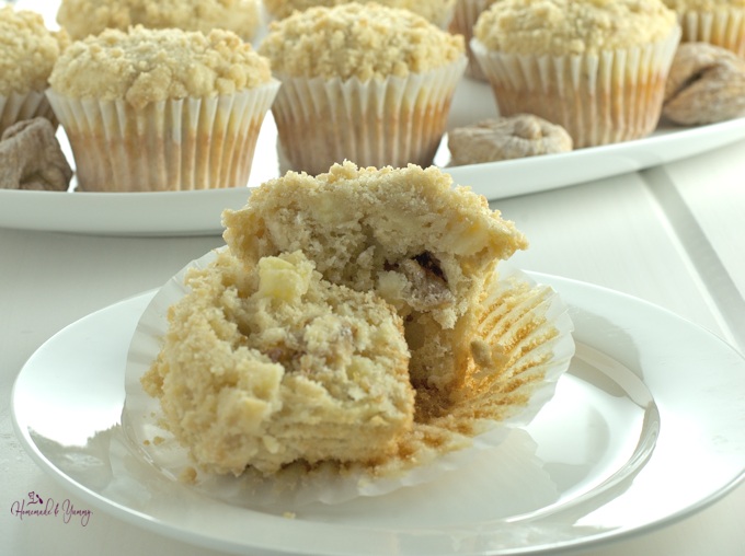 Apple muffin cut in ½ on a plate.