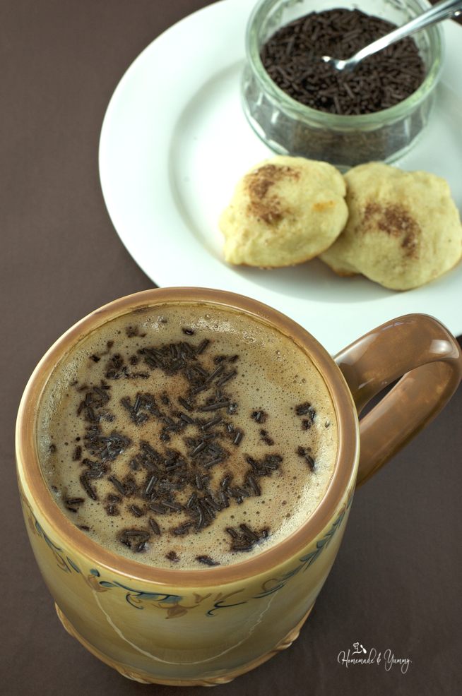 Mocha Latte with cookies on a plate.
