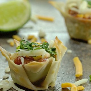 Guacamole Appetizer Bites are the perfect party food!! Guacamole, salsa and cheese in a wonton cup. Quick, easy and so delicious!! |homemadeandyummy.com