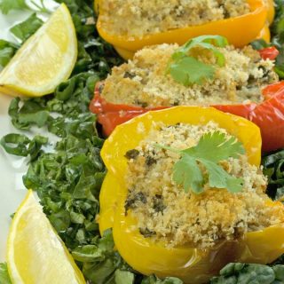 Quinoa Stuffed Bell Peppers are packed with protein and the flavours of crab, spinach and goat cheese. Perfect, tasty one dish dinner. Great meatless alternative. | homemadeandyummy.com