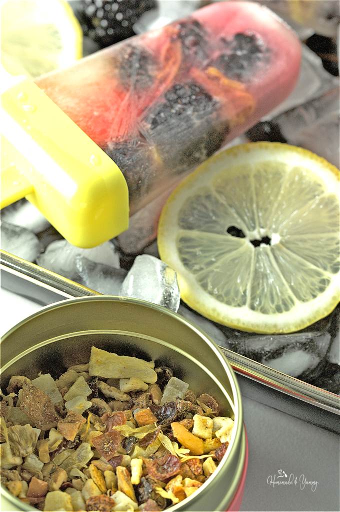Close up of a Blackberry Lemon Tea Pop with dried tea in the forefront.
