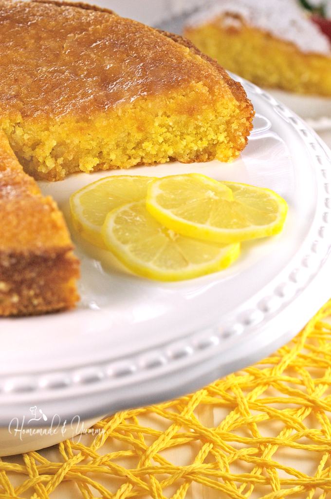 Lemon cornmeal cake on a cake platter.