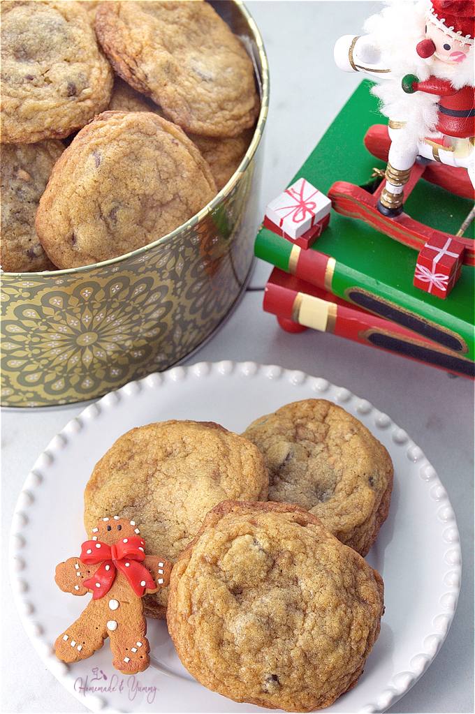 Chocolate chip and ginger cookies on a plate and in a tin.