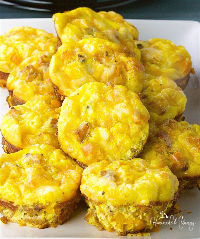 Baked egg muffins piled on a serving platter ready to eat.