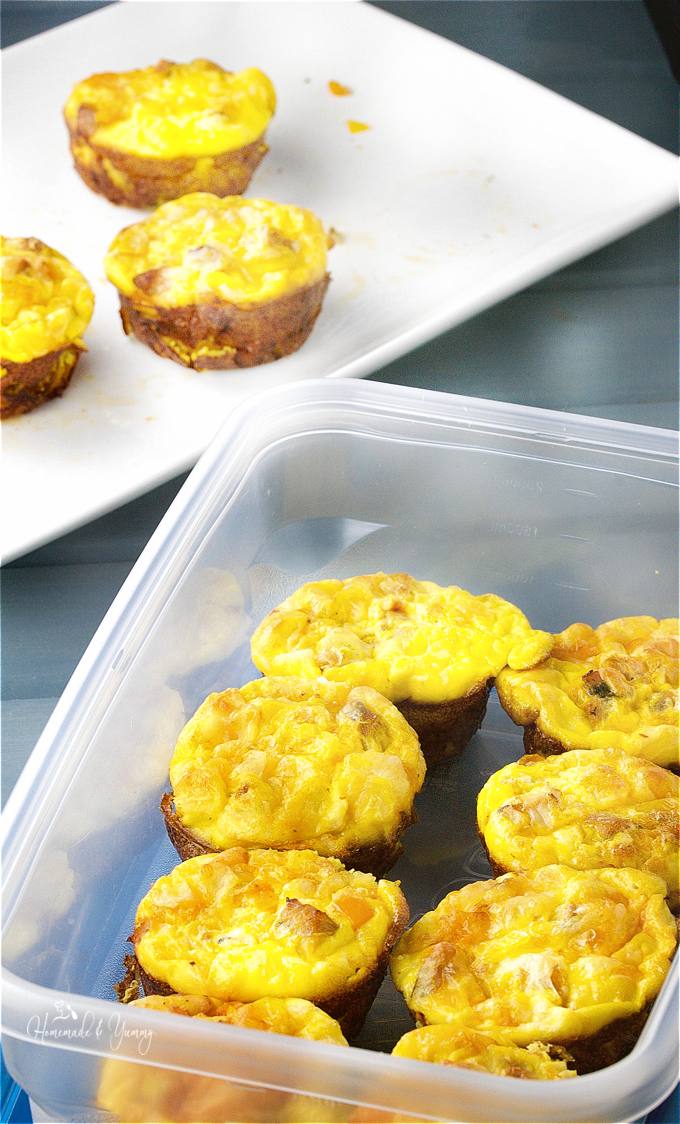 Egg Muffin Baked Omelette getting put into a freezer container for storage.