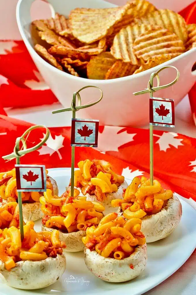 Canadian Inspired Mushroom Bites Celebrating #Canada150 on a plate with Canadian flags.