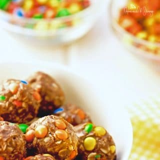 Loaded No Bake Peanut Butter Oatmeal Cookie Balls are easy for little hands to make. Kids have fun in the kitchen making these tasty candy loaded bites.| homemadeandyummy.com