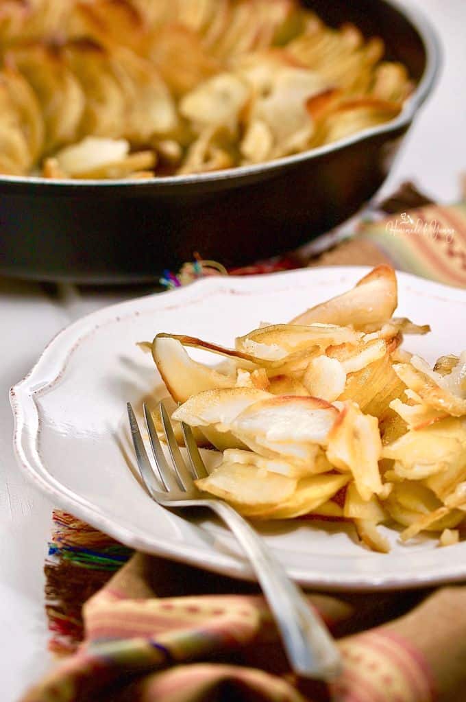 Crispy skillet roasted potatoes on a plate.