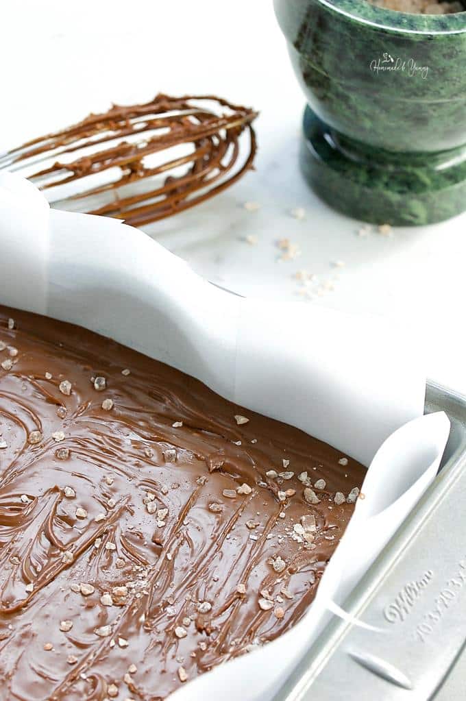 Chocolate Fudge in a pan sprinkled with sea salt.