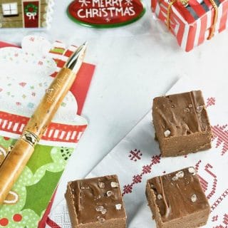 Overhead shot of 3 pieces of fudge on a Christmas napkin.
