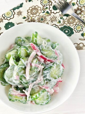 Overhead shot of Cucumber Salad with Pickled Onions in a bowl.