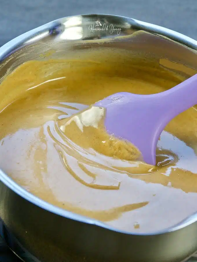 Peanut butter getting warmed in a pot.