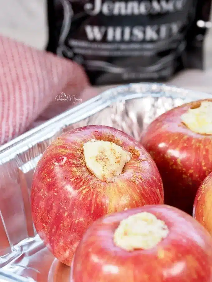 A foil pan full of apples ready to cook.