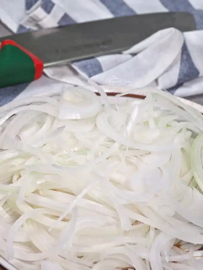 Thinly sliced onions ready to caramelize.