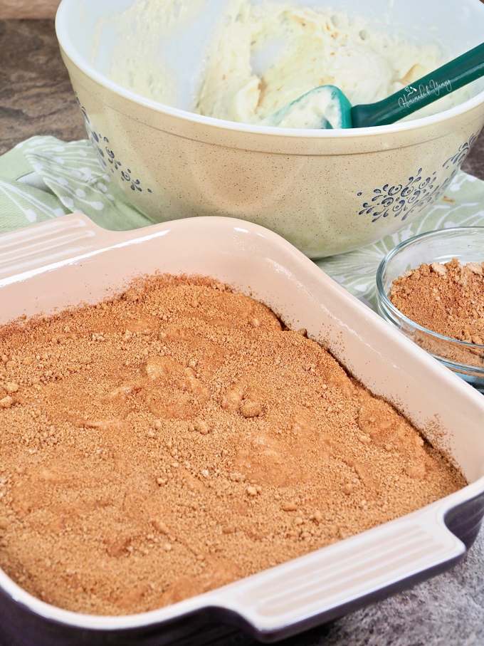 Layering the cake batter in a baking dish.