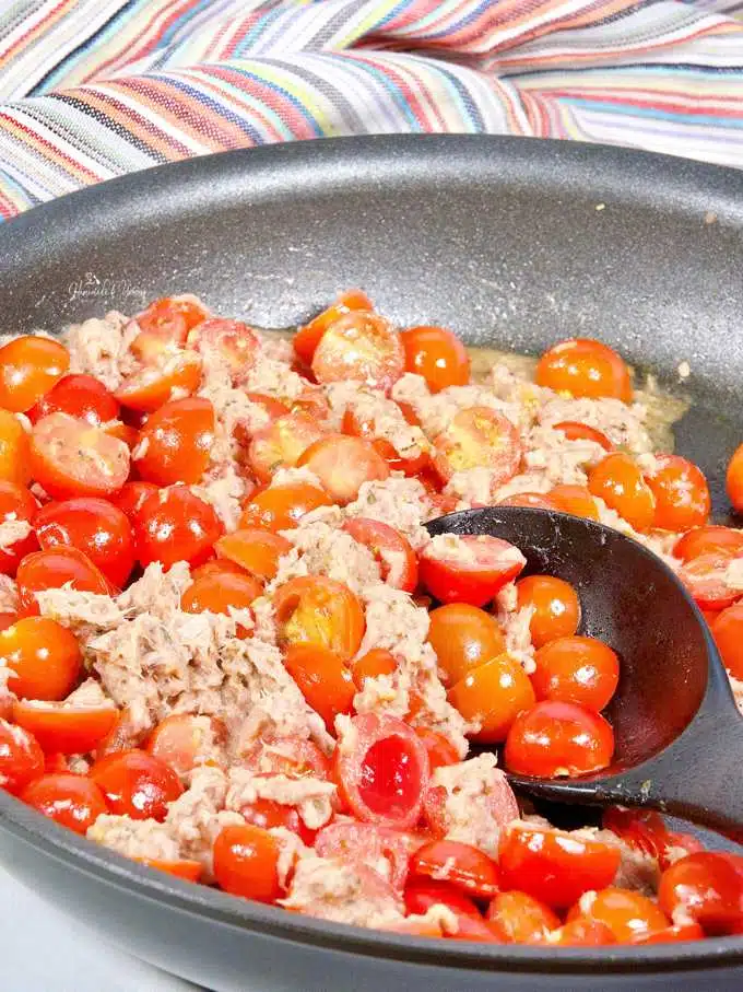 Canned tuna and tomatoes getting cooked for the tuna pasta toss.