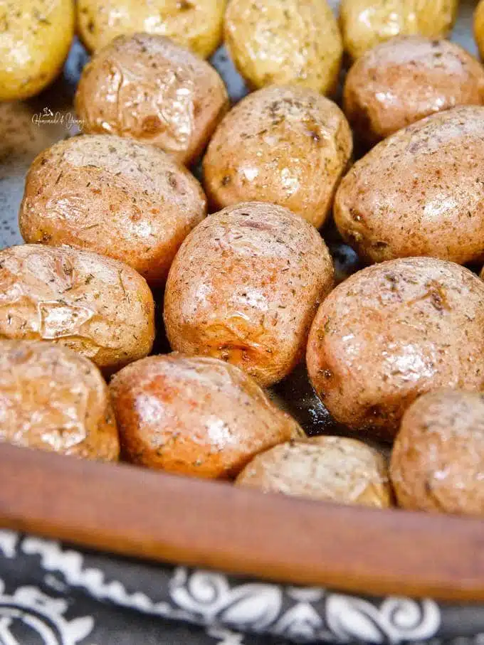 Mini baked potatoes ready to be cut and assembled into  appetizers.