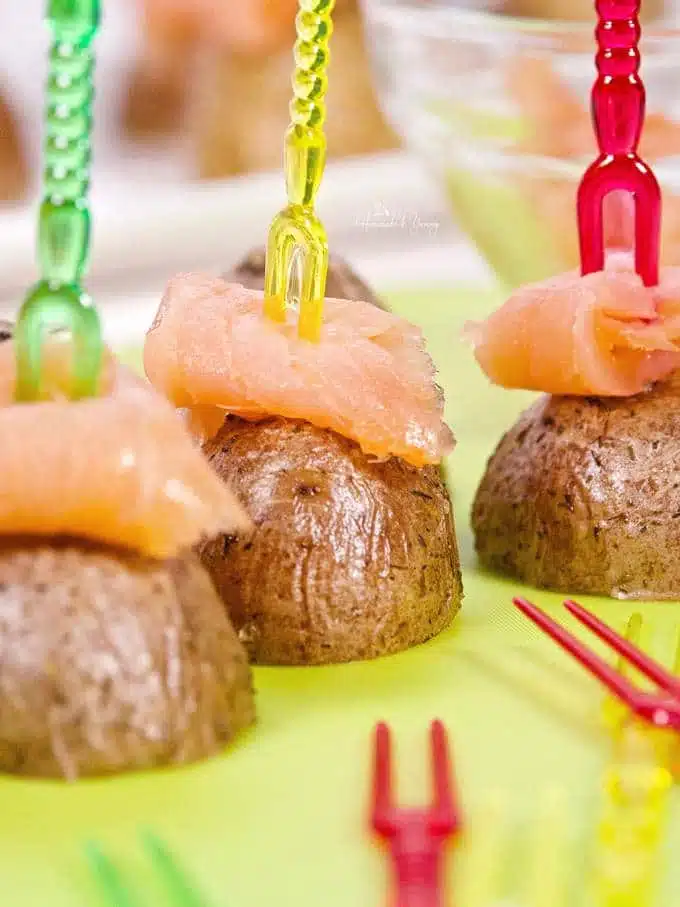 Skewered  potatoes topped with salmon, 