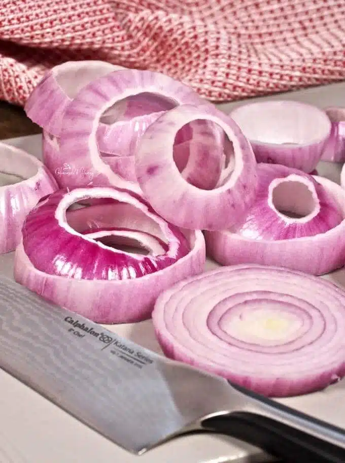 Onion cut into slices and separated into rings.