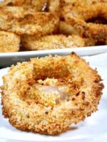 Close up of Crispy Air Fryer Onion Rings on a plate.