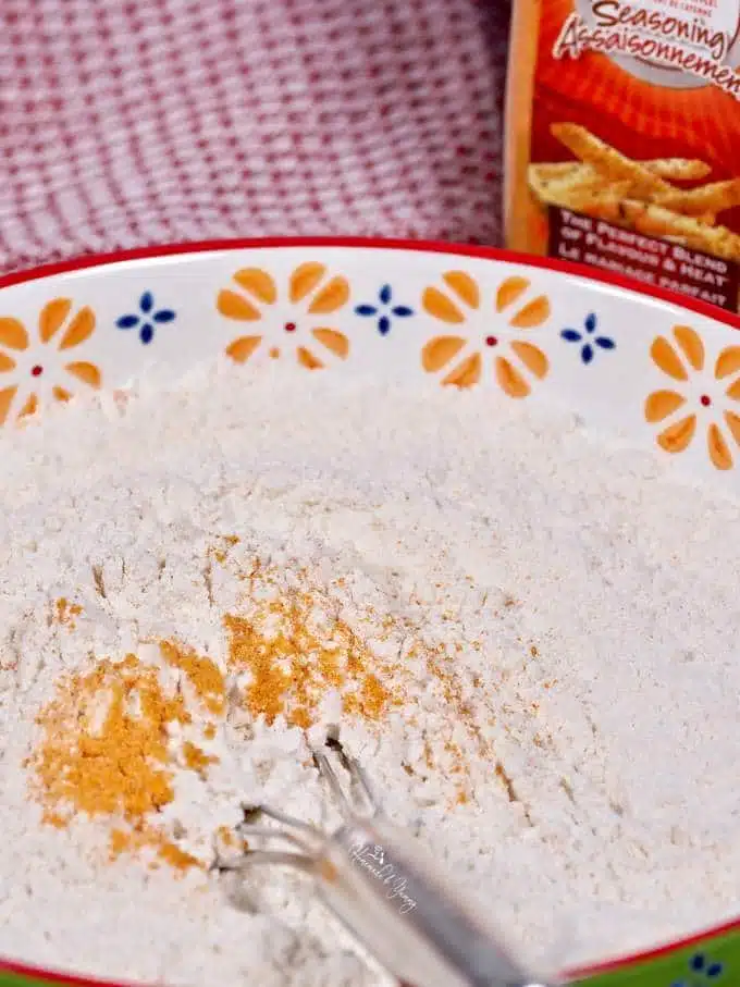 Seasoned flour for the in a bowl.