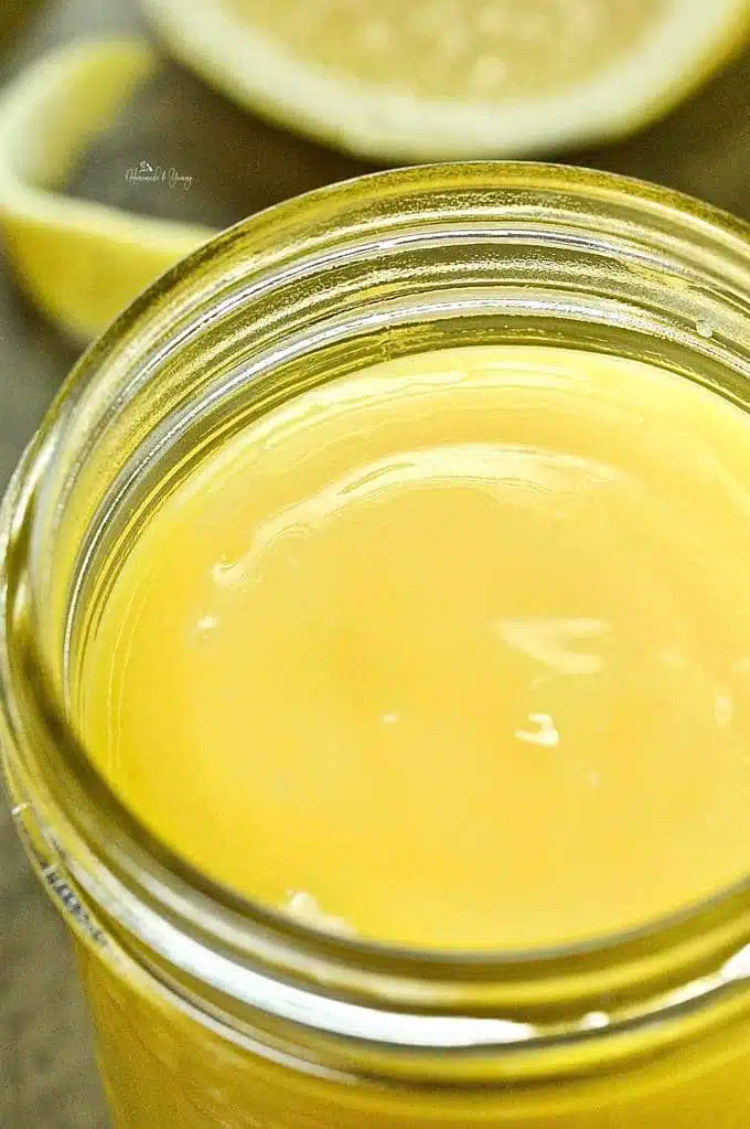 Overhead shot of lemon curd in a jar.