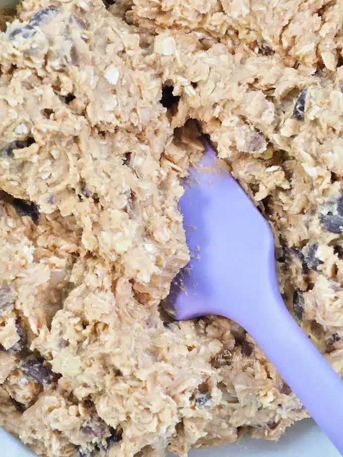 Cookie dough getting mixed in a bowl.