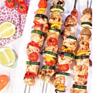 A platter of Grilled Chili Lime Chicken Skewers ready to eat.