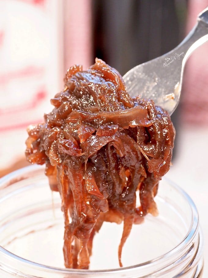 Close up shot of onion jam on a fork.