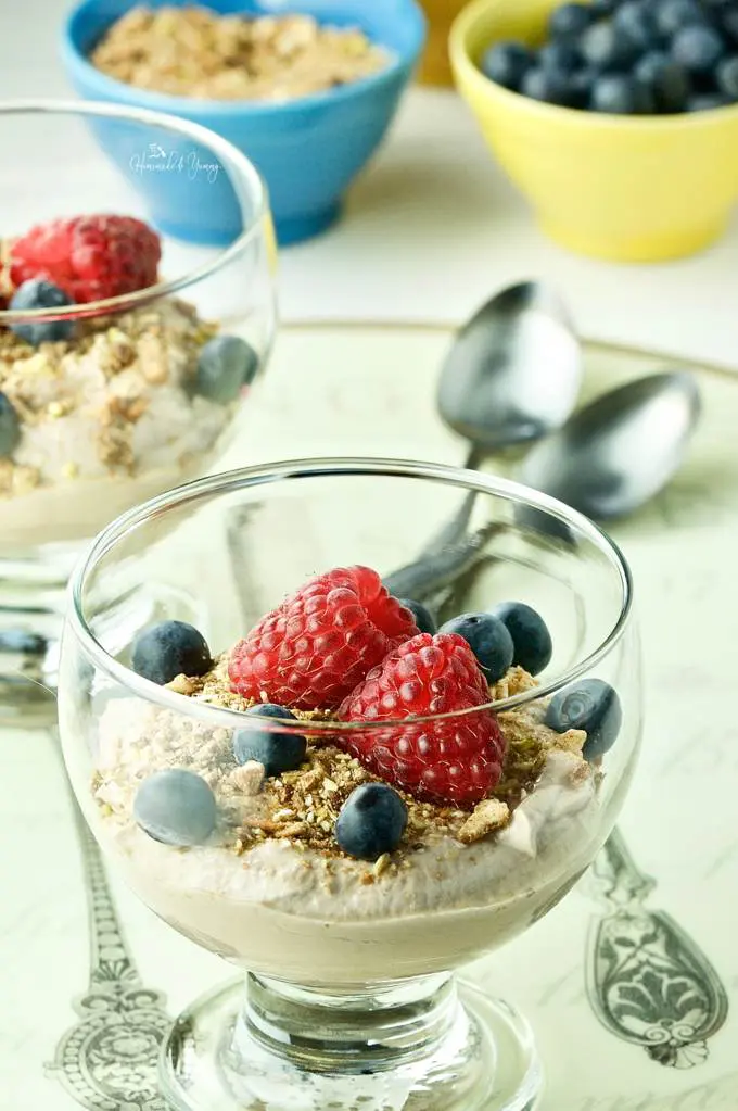 Close up shot of coffee yogurt with fresh berries and granola.