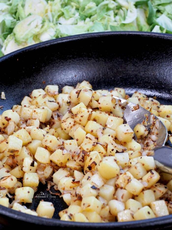 Potatoes cooking in a skillet