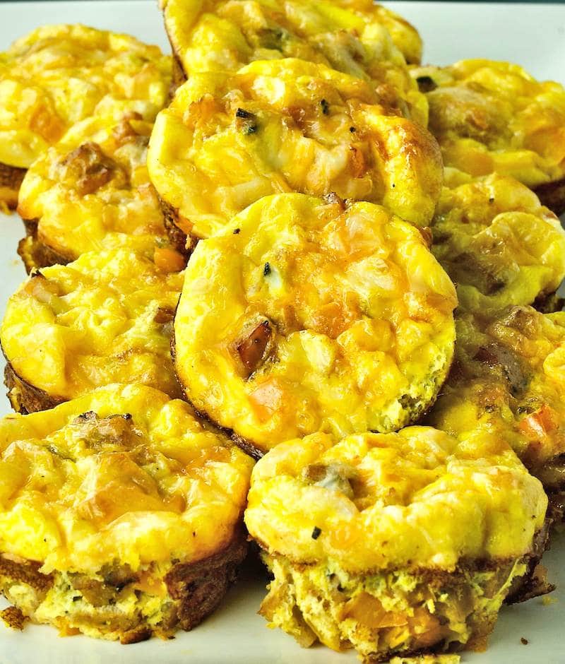 A pile of baked egg muffins on a plate.