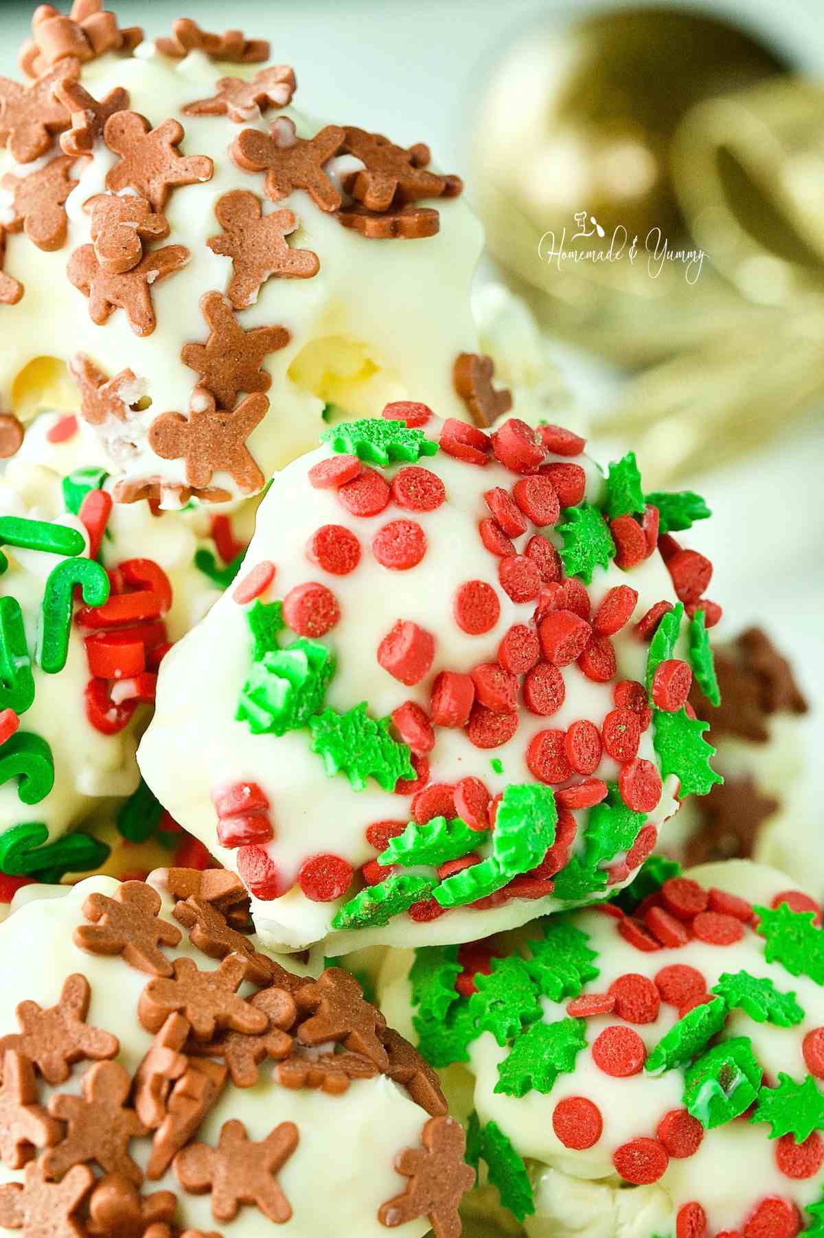 White Chocolate Popcorn Balls covered in holiday sprinkles