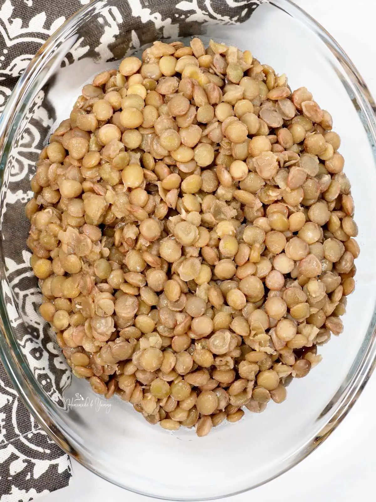 Marinated Lentils in a glass bowl ready for storage