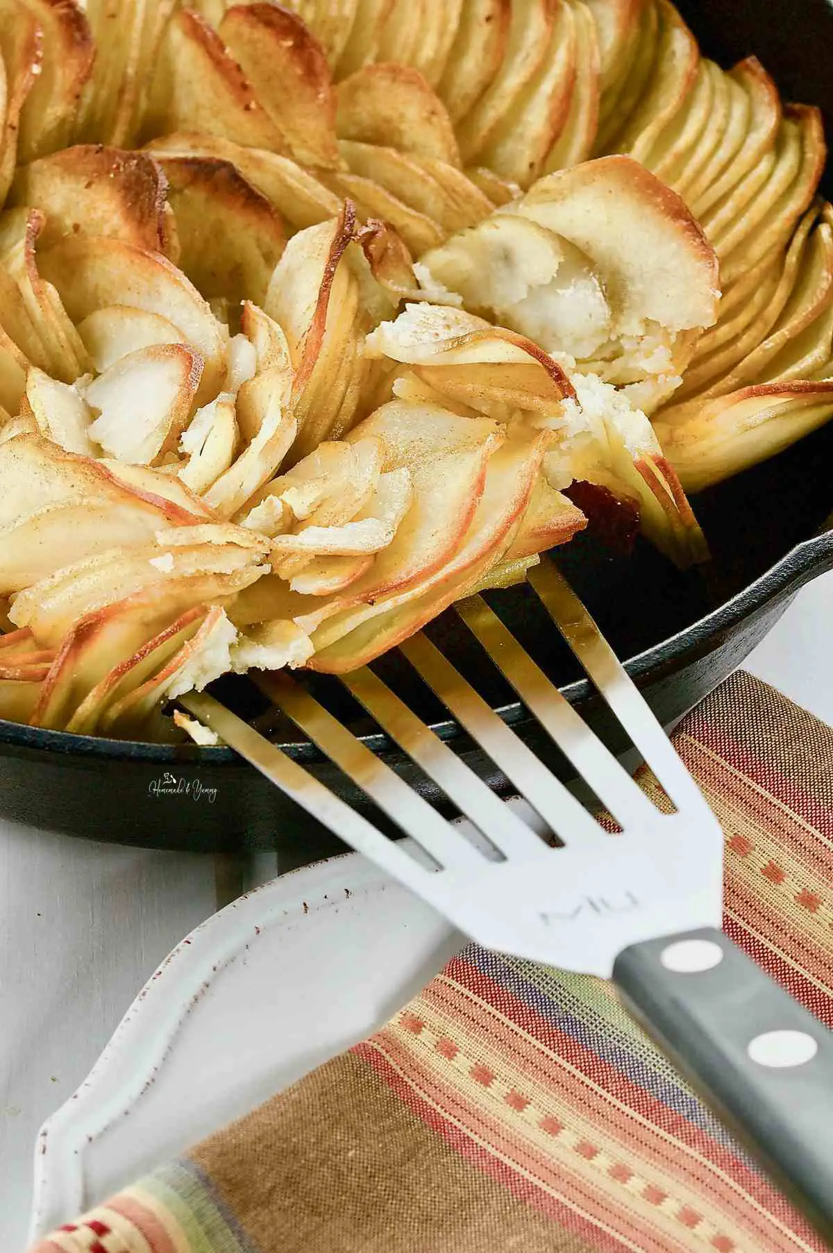 Crispy fried potatoes in a cast iron skillet.