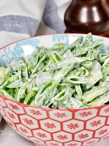 A bowl of sugar snap pea salad.