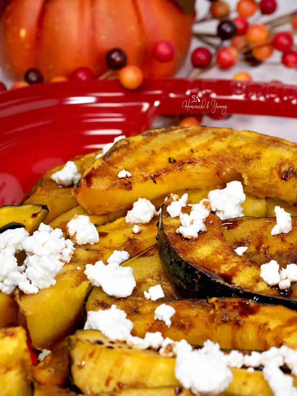 Feta cheese and balsamic topped squash slices.
