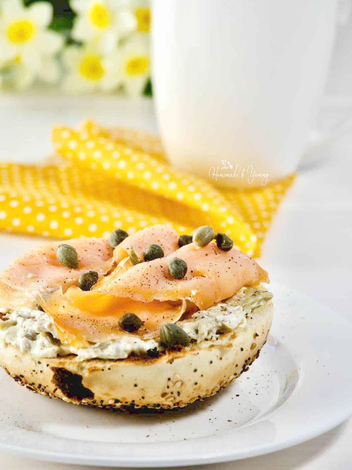 Smoked salmon on a bagel with cream cheese and capers.