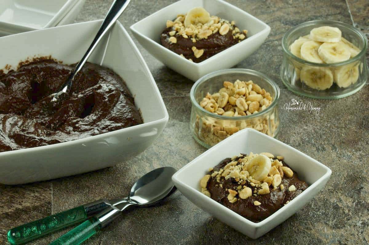 Placing pudding into serving bowls.