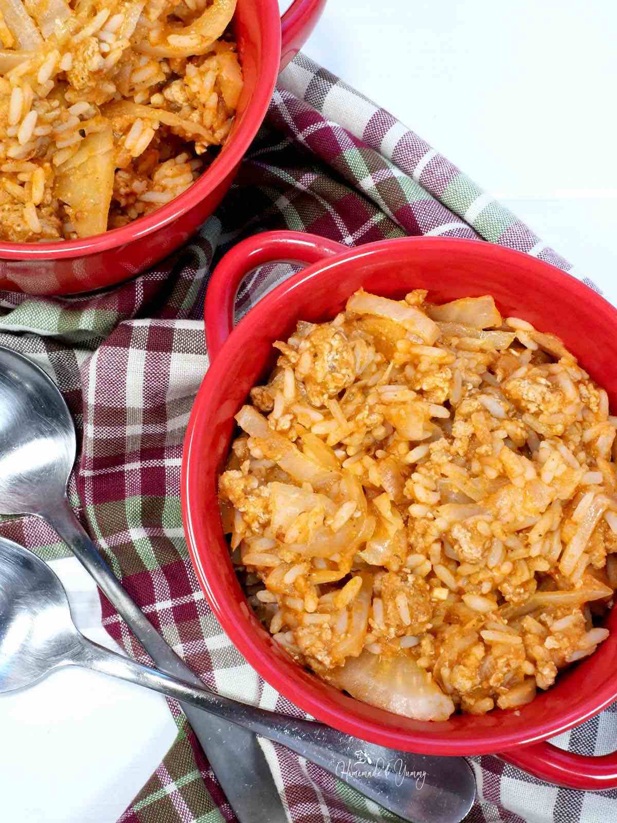 Unstuffed cabbage casserole in a red bowl.