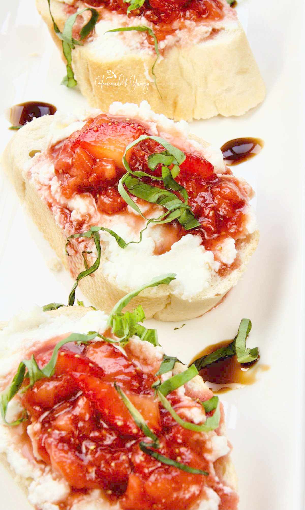 Sweet Strawberry Bruschetta on a plate ready to eat.