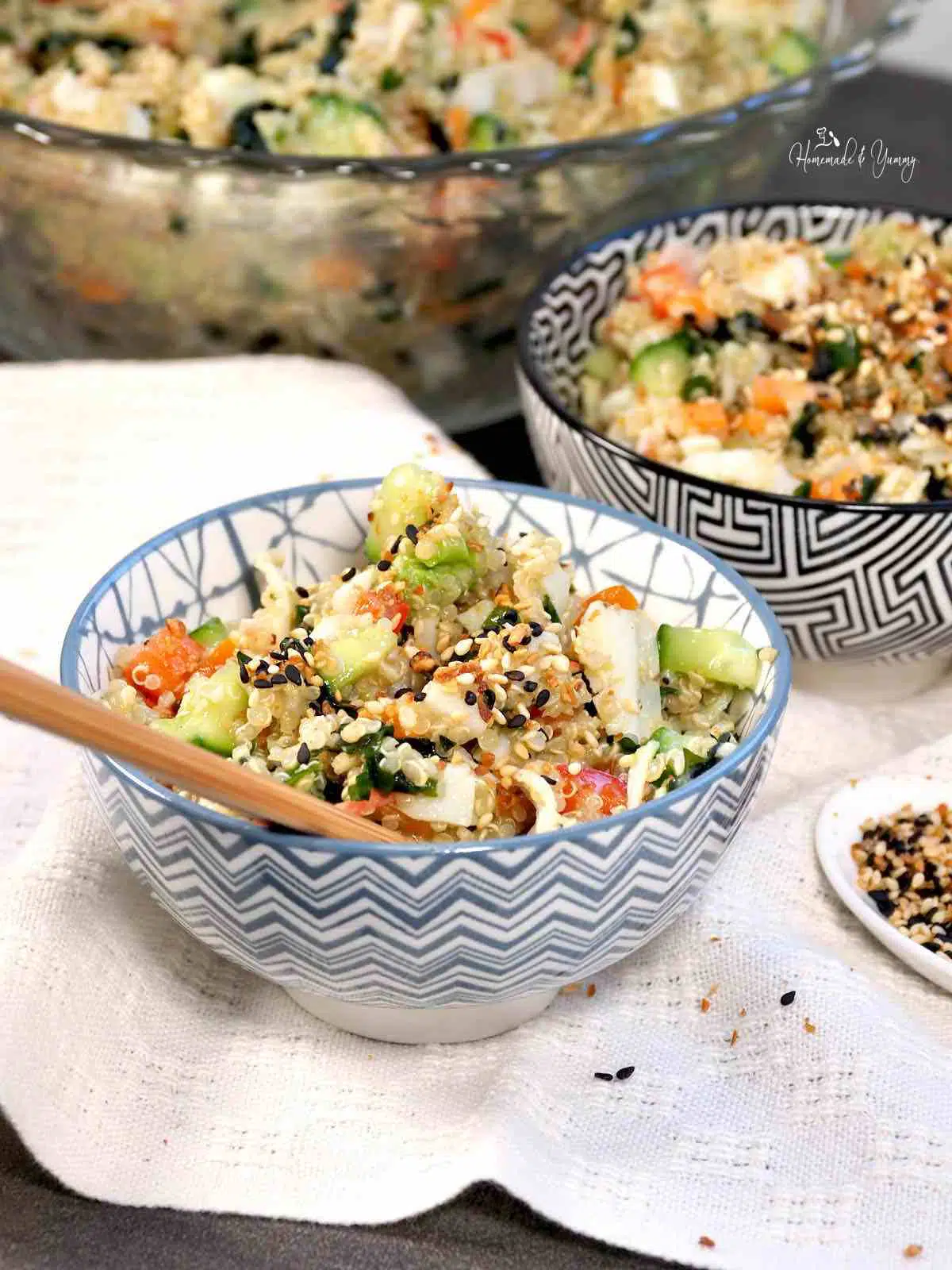Sushi quinoa salad in a blue and white bowl.