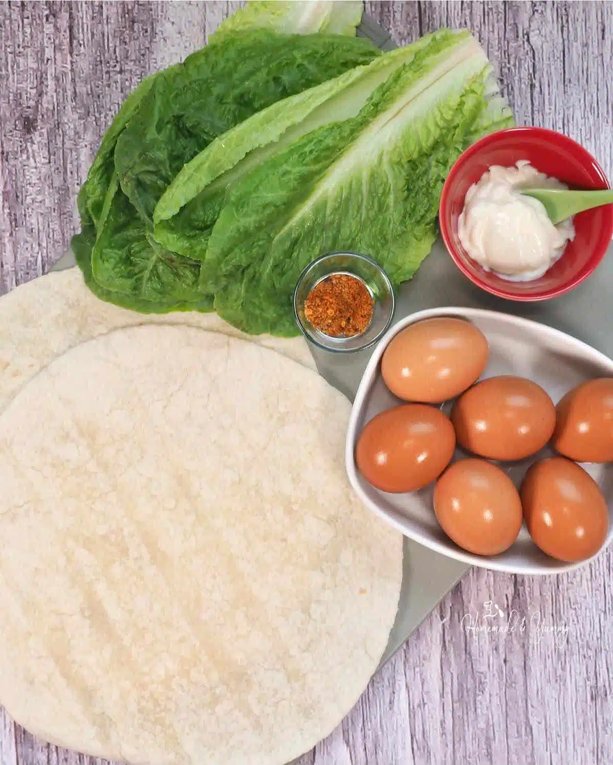 Ingredients for making egg salad sandwich wraps.