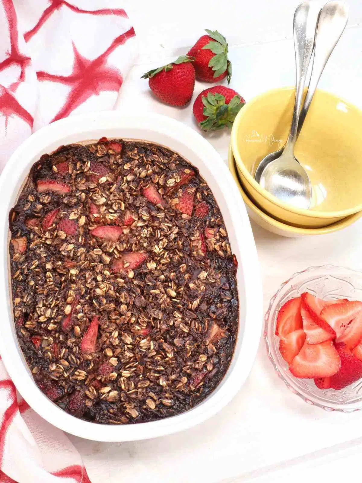Chocolate baked oats with strawberries ready to eat.