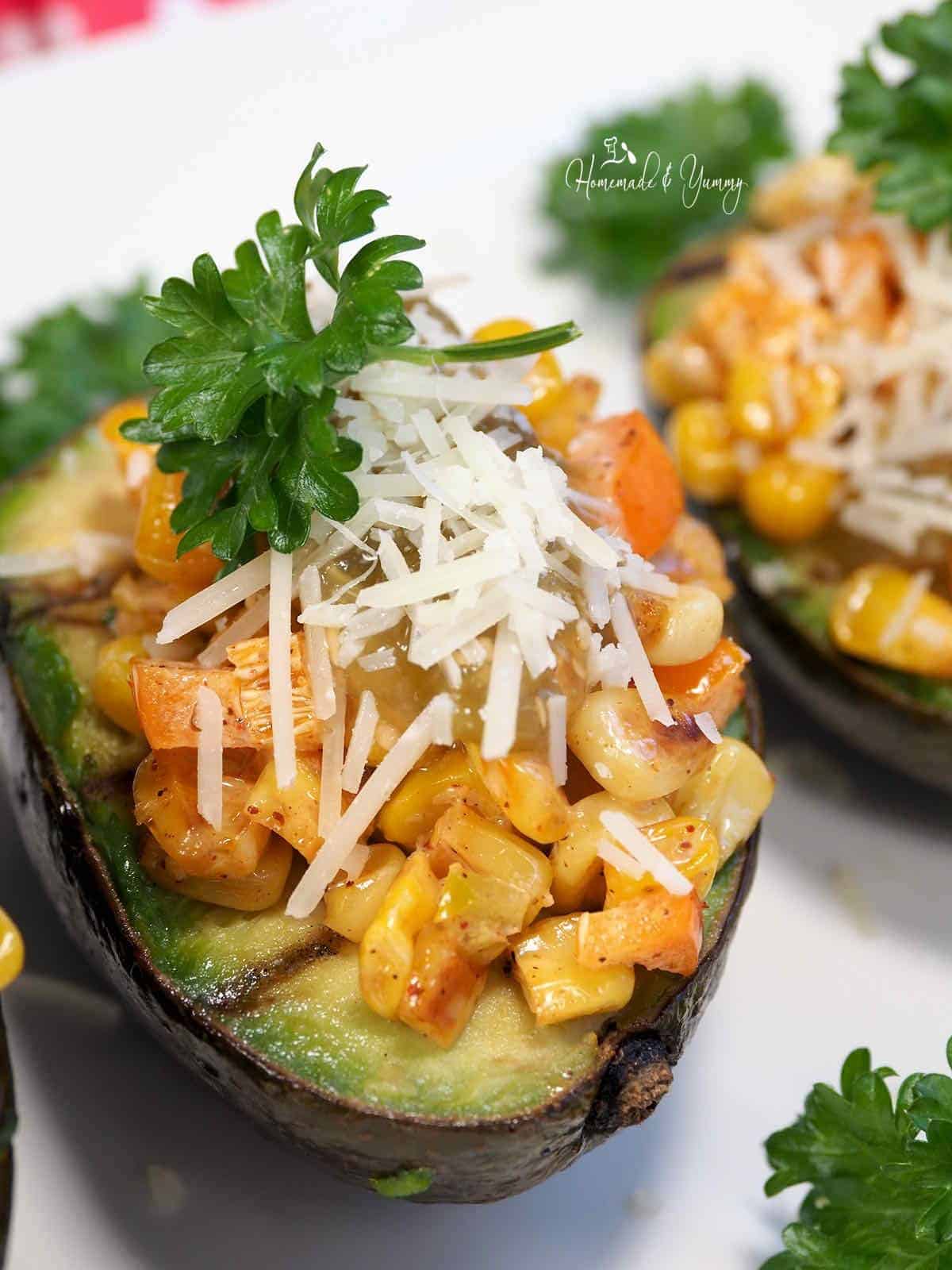 Mexican corn stuffed grilled avocado halves.