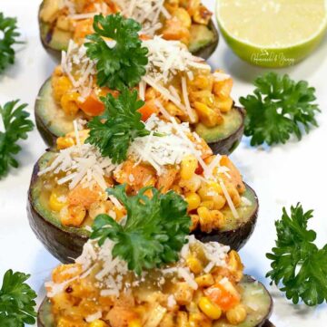 Grilled Avocado Boats stuffed with Mexican corn.